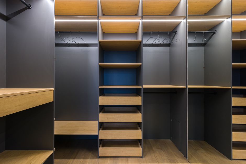 Custom wooden wardrobe built into a bedroom wall