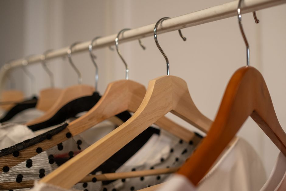 Clothes neatly organized on wooden hangers